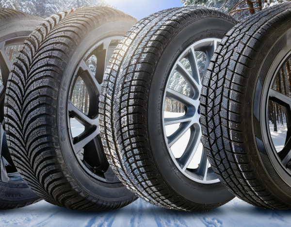 Winter tires in pine forest during the winter season with snow